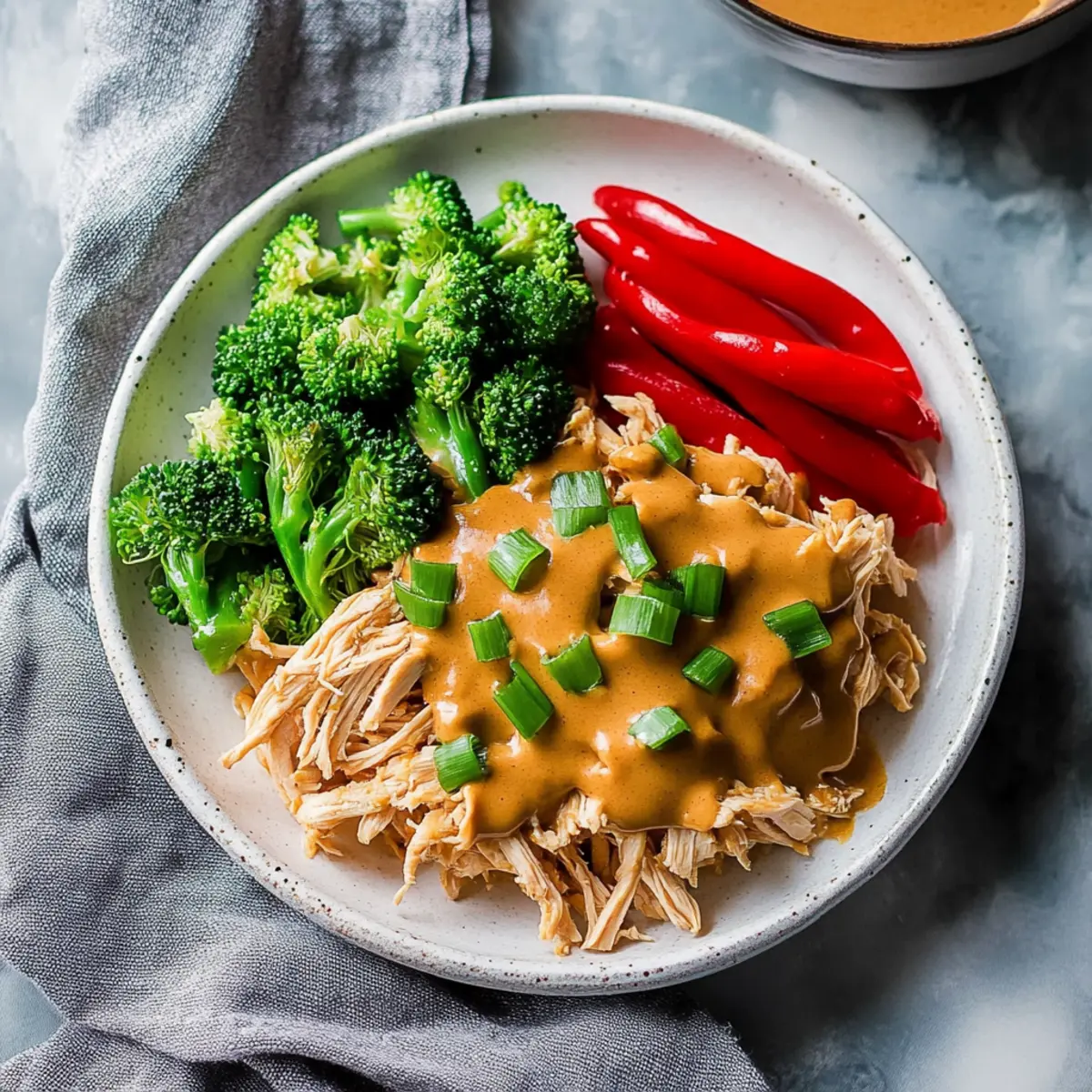 Slow Cooker Pulled Chicken with 5-Ingredient Peanut Sauce