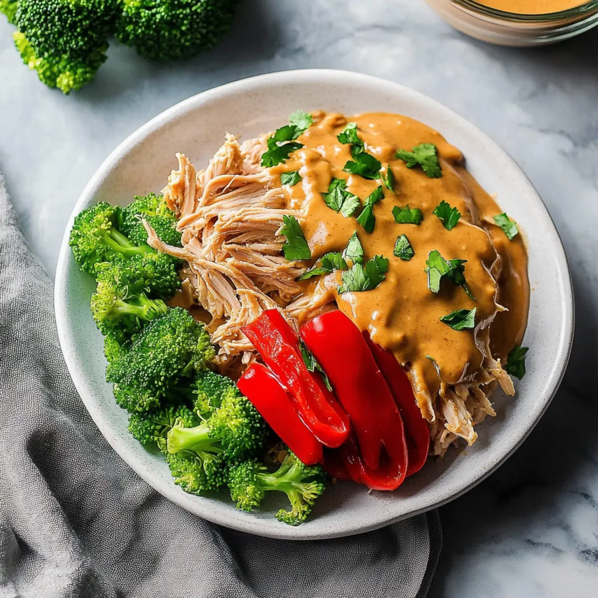 Easy Slow Cooker Pulled Chicken with Irresistible Peanut Sauce